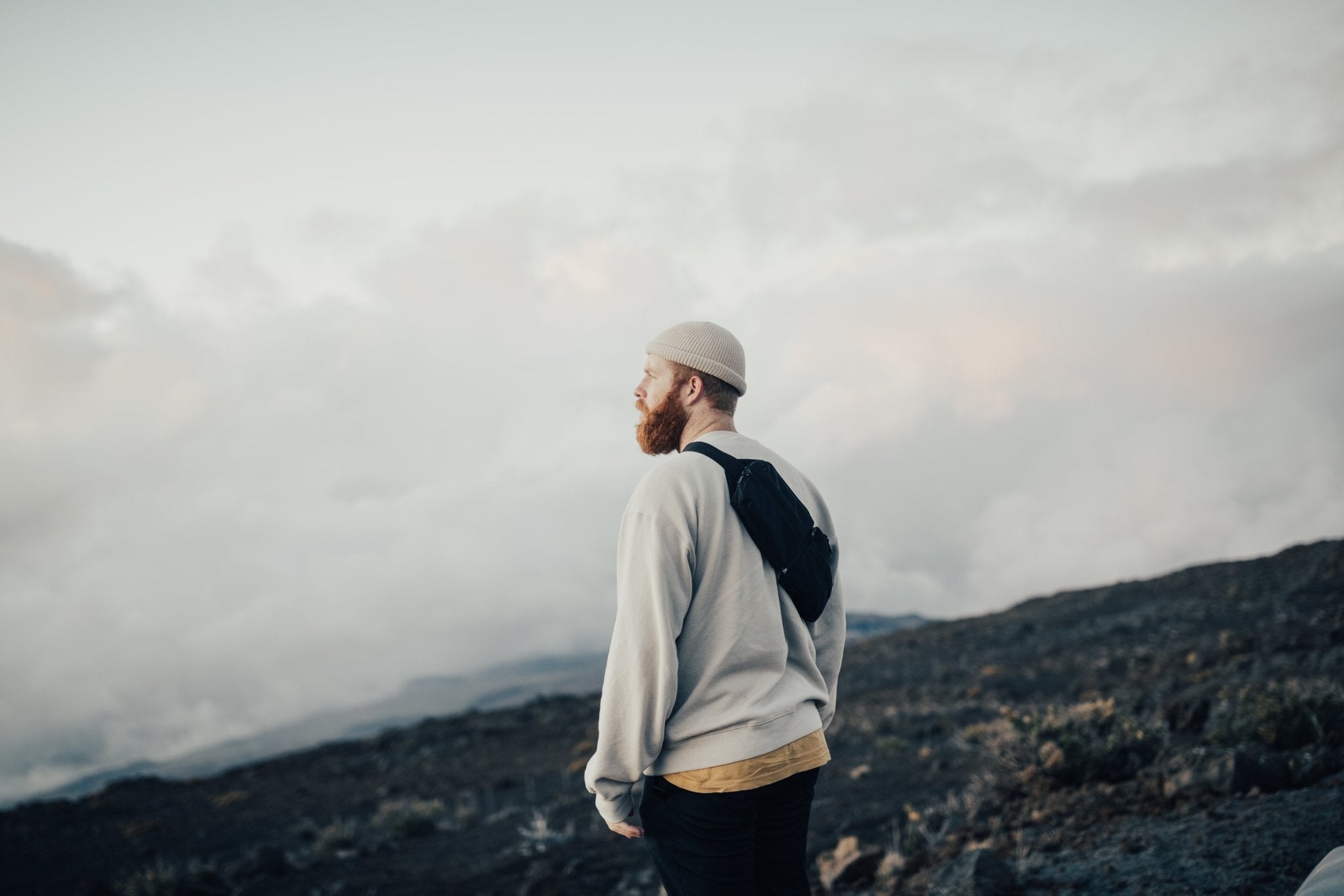 2L Sling Belt (42L Backpack Waist Belt/Sling Bag) - Gravel - Man wearing 2 Liter sling bag across back outside