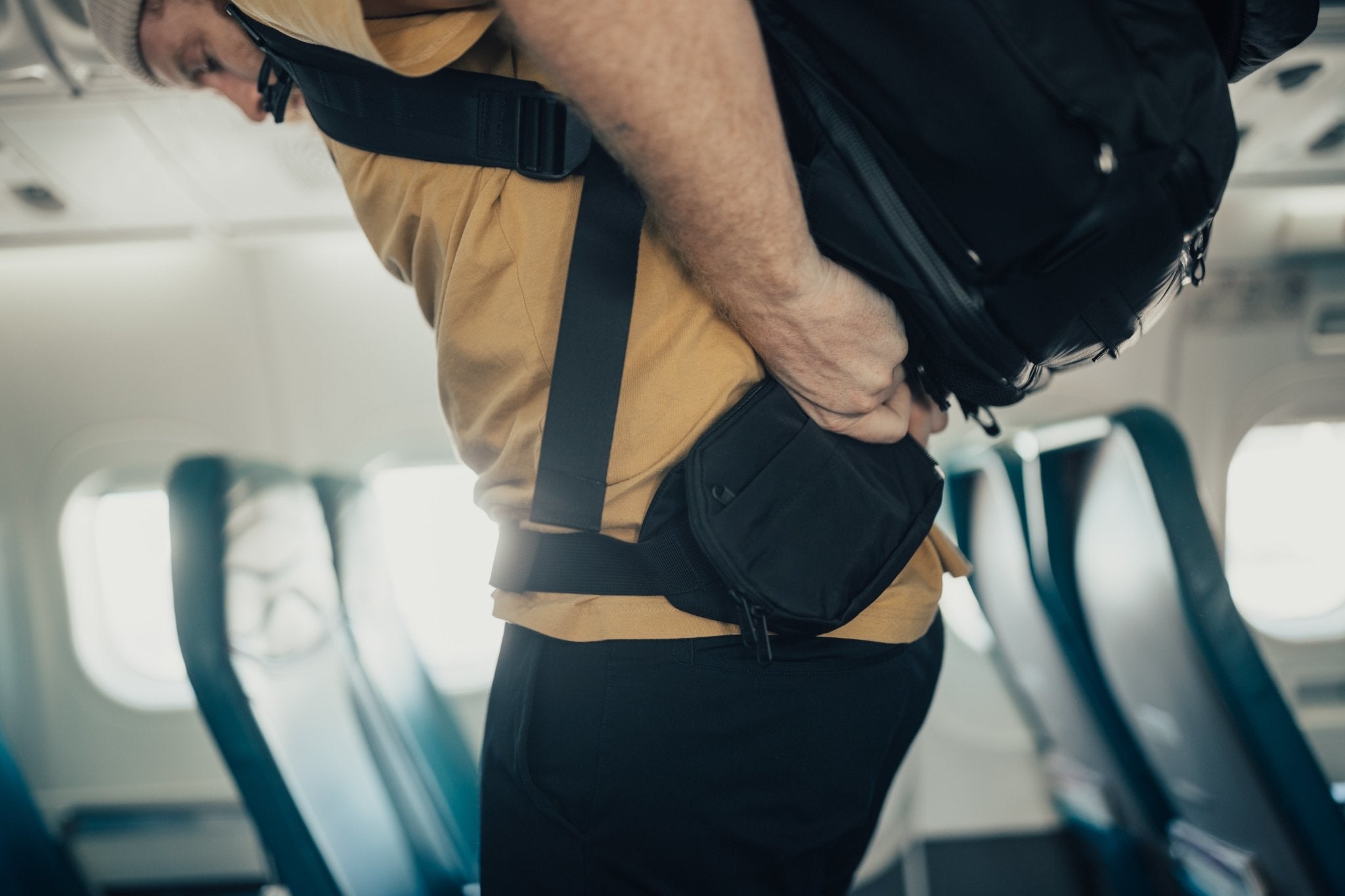 Unclipping the 2 Liter Sling Bag from the 42 Liter Bag