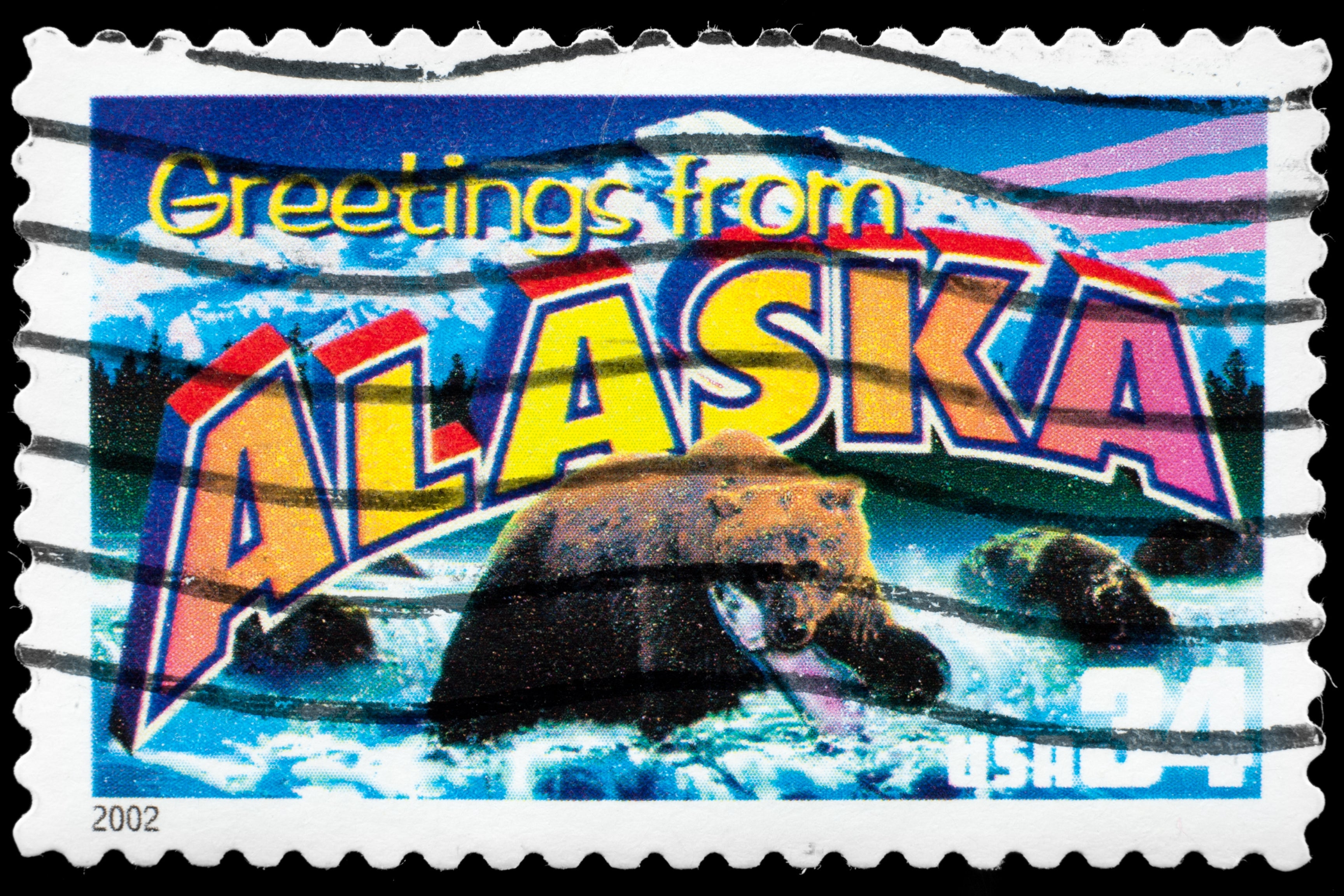 Alaska souvenir postage with bear and snow-capped mountain