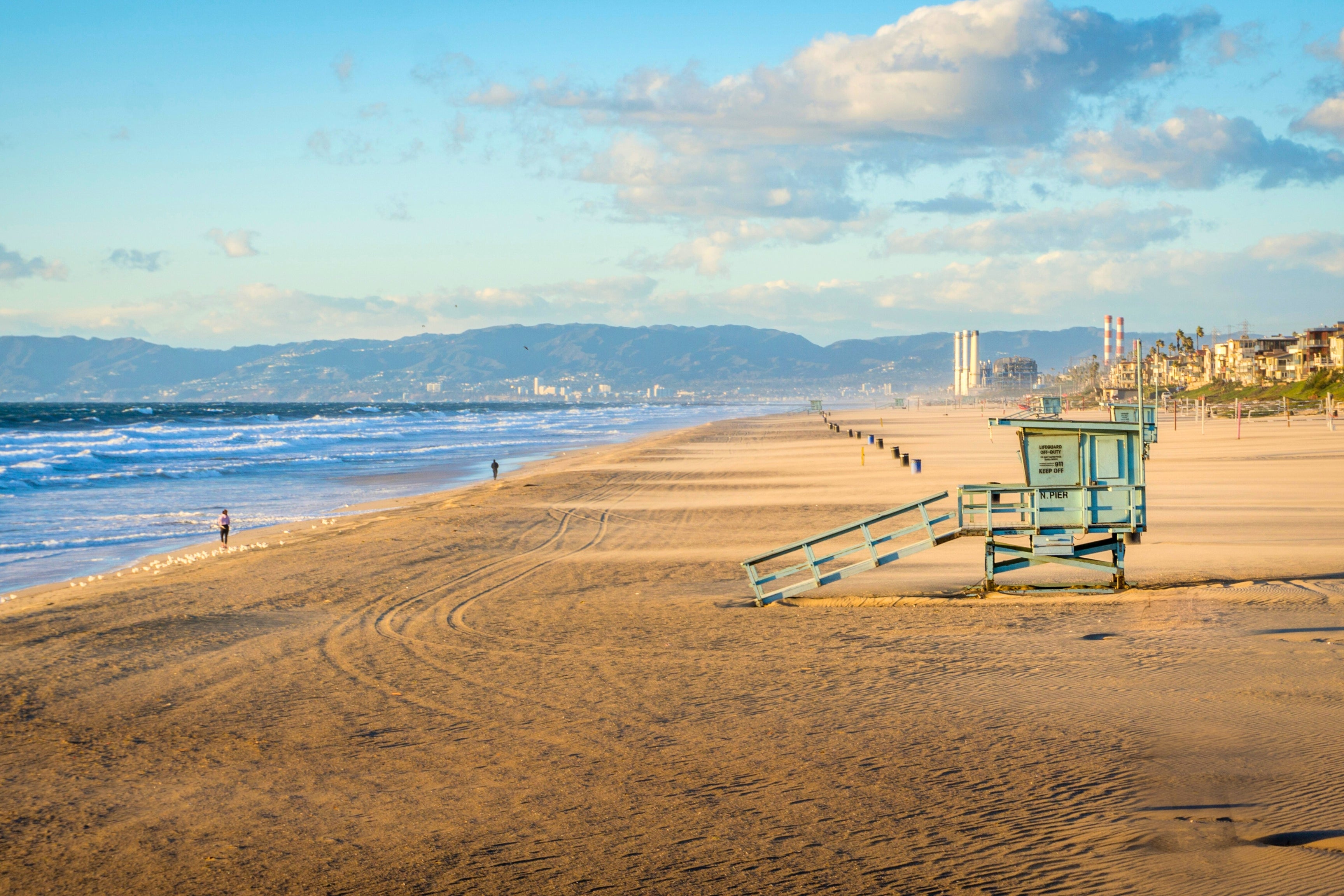 los angeles beach blue lifeguard post gold sand mountains