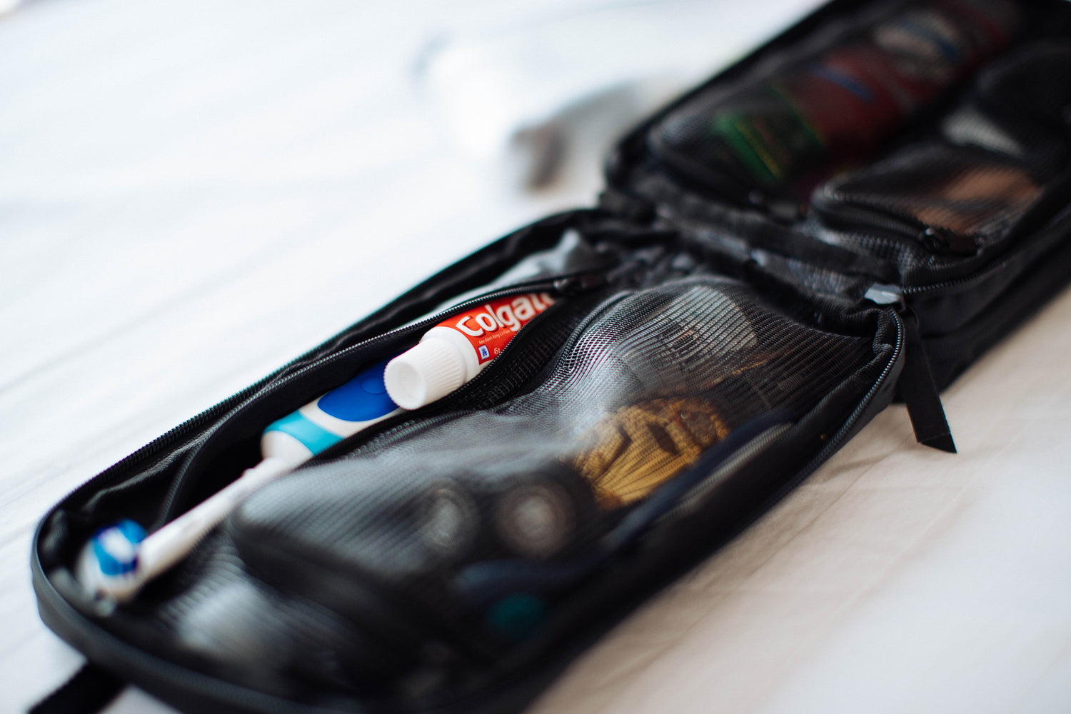 open toiletry bag with toothbrush