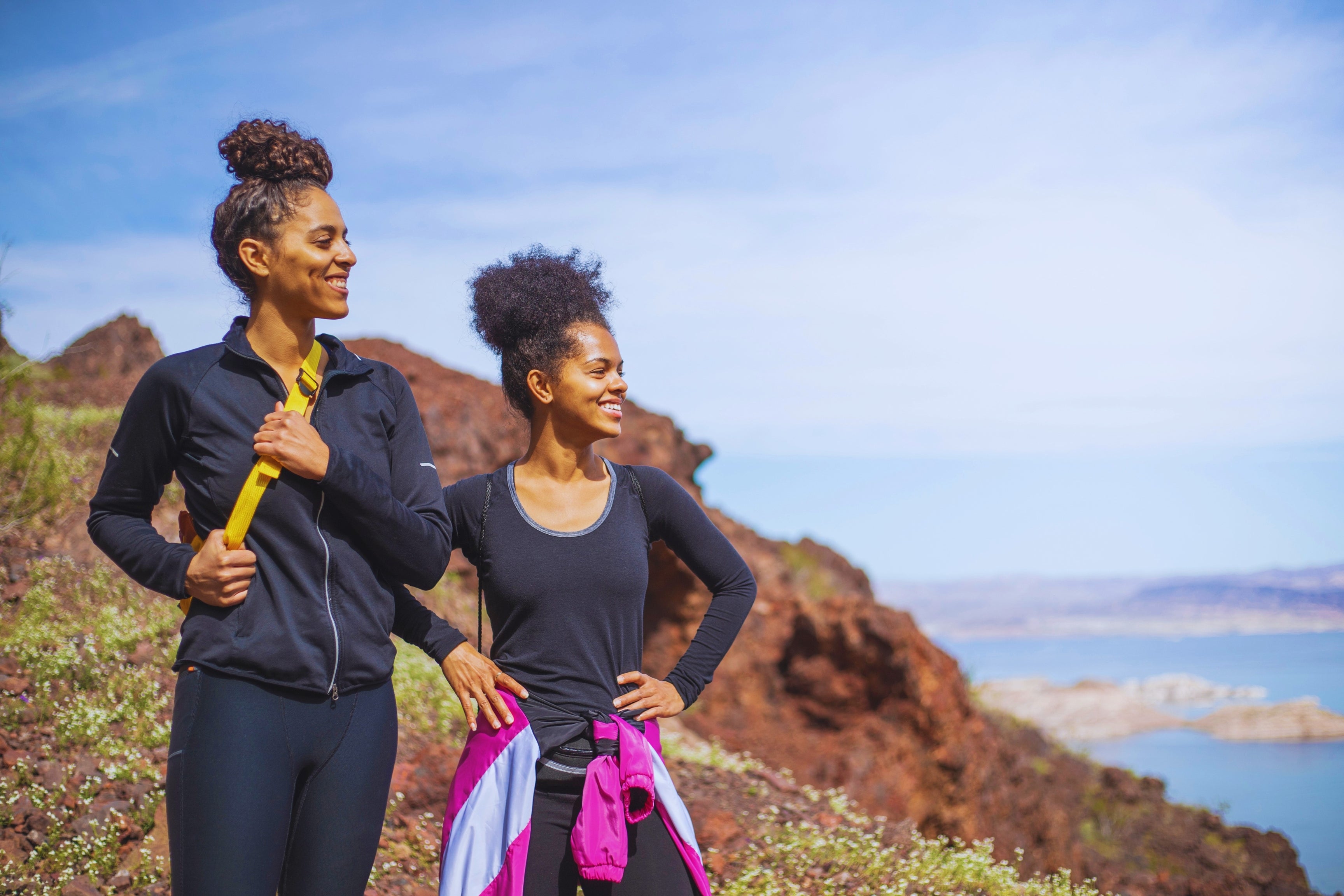 outdoorsy hikers on seaside cliff