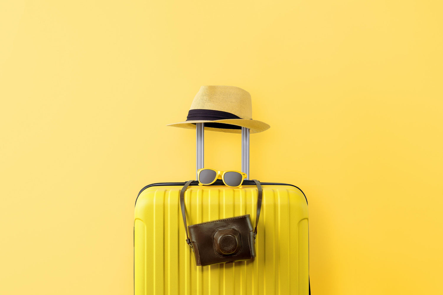 summer destination travel yellow suitcase