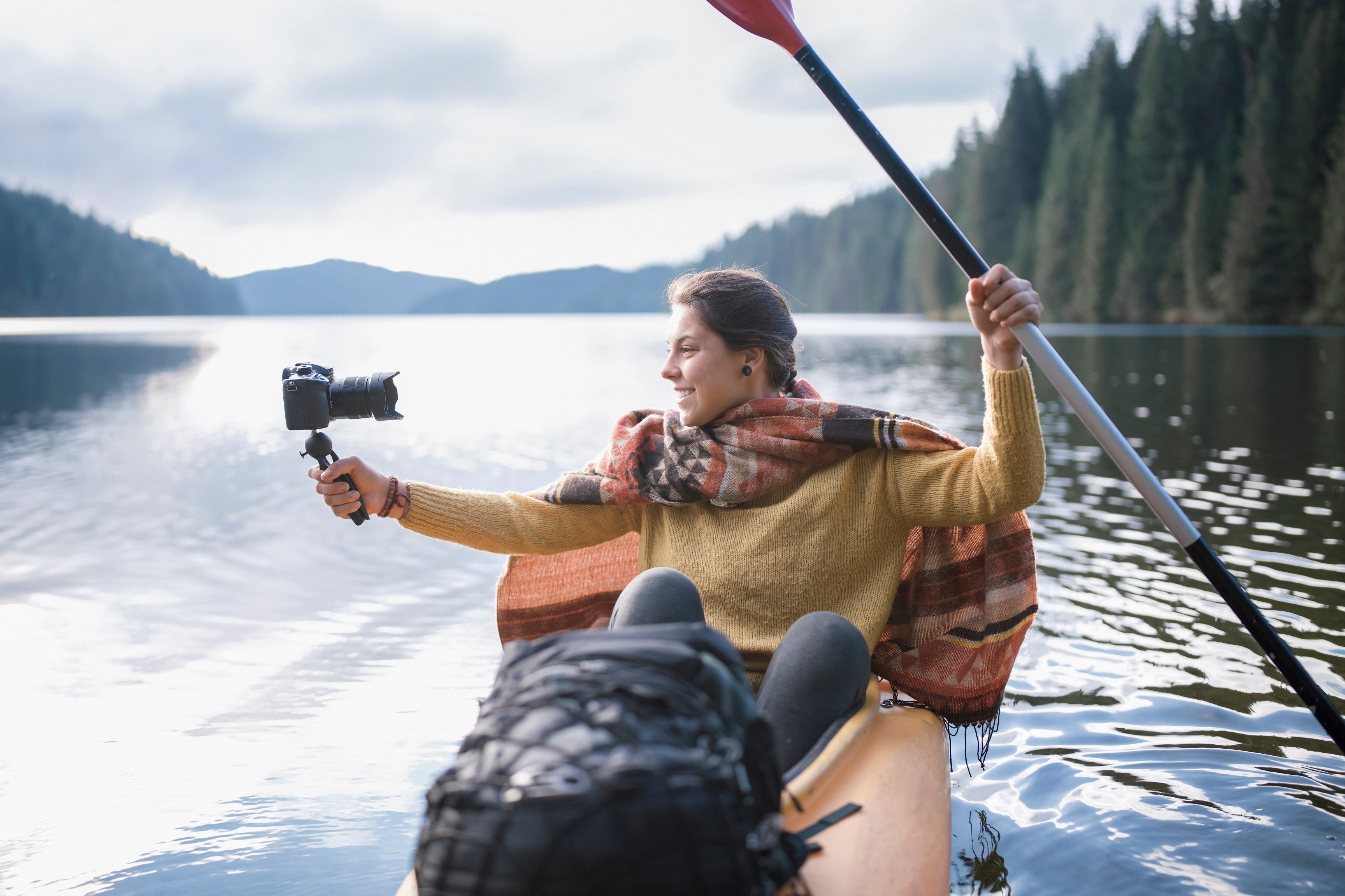 travel vlogging woman on kayak