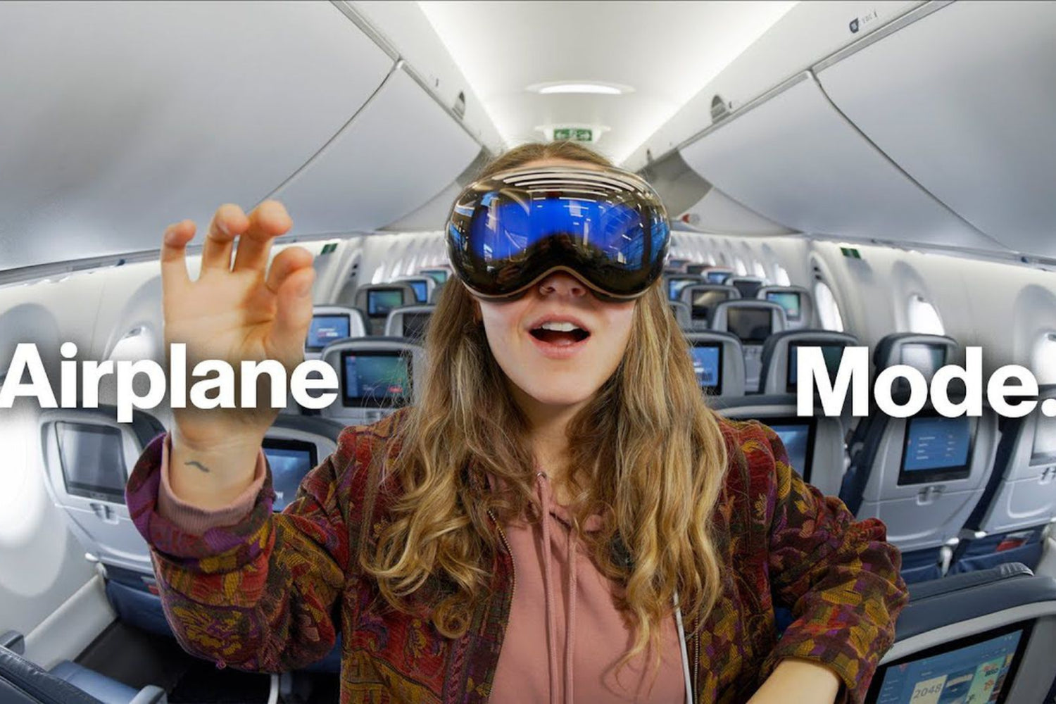 traveler wearing apple vision pro on airplane