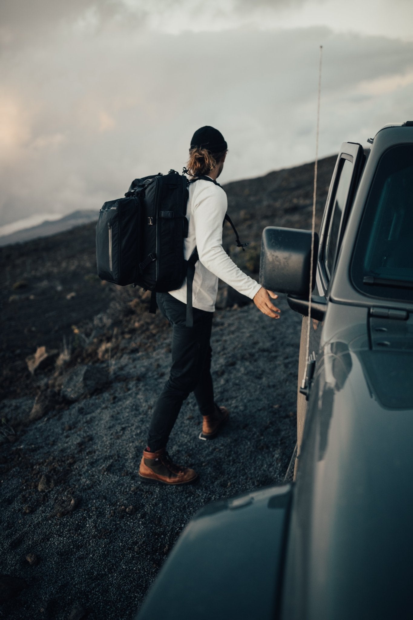 11L Day Bag - Gravel - Man with 11 liter backpack attached to a 42 Liter Backpack outside