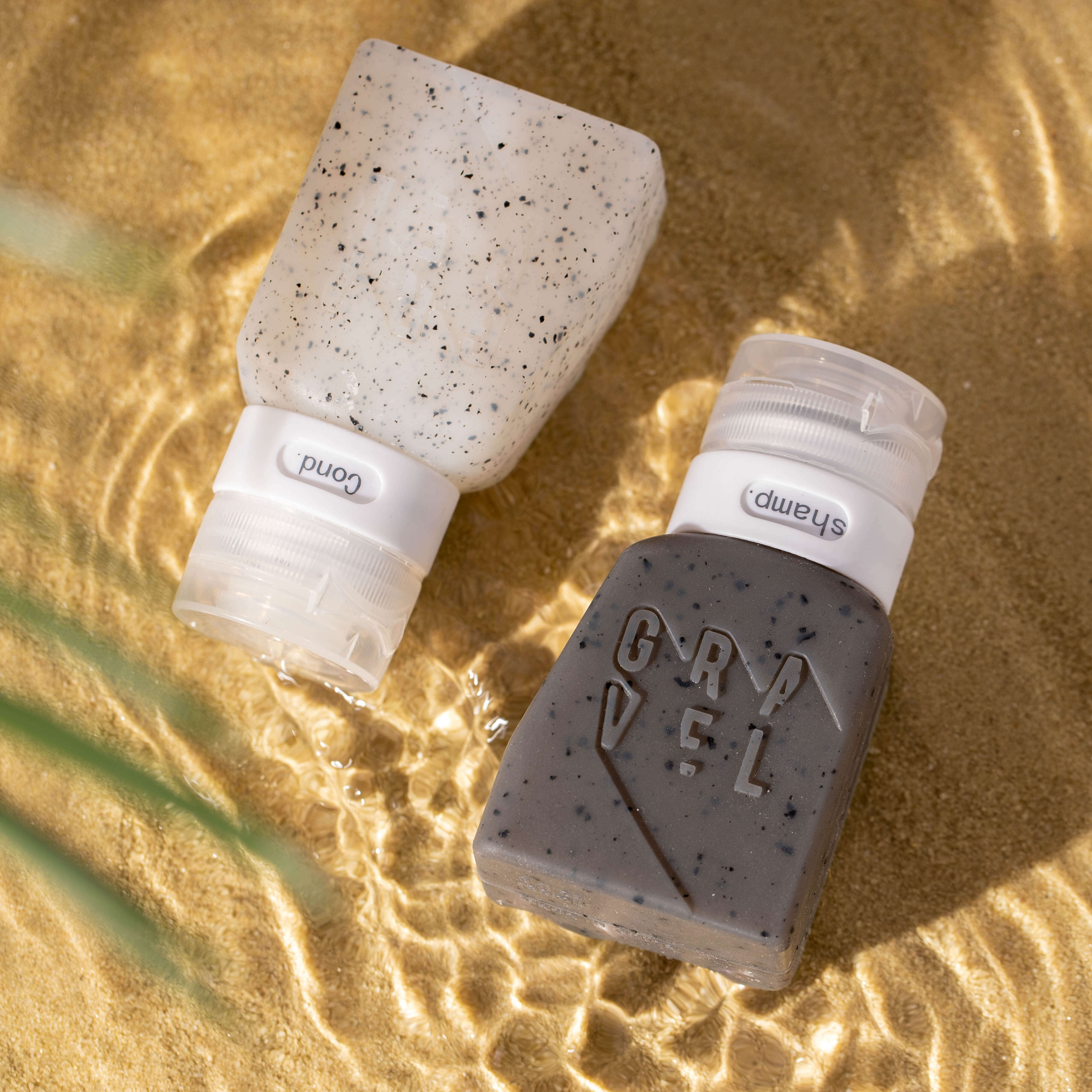 https://www.graveltravel.com/cdn/shop/products/ToiletryBottles-Sand-Edited.jpg?v=1691018934&width=3648